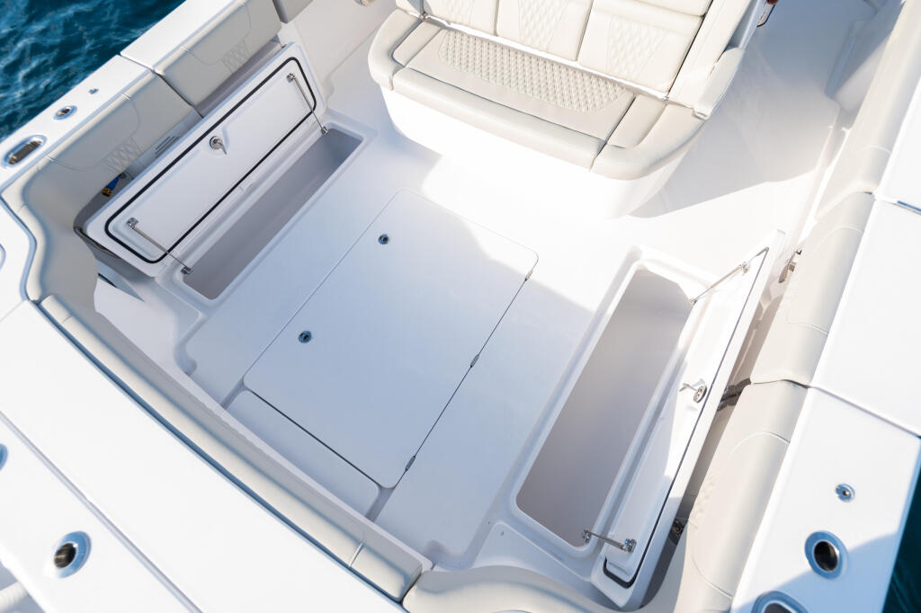 Overhead view of boat's stern deck with 290-quart in-deck fish boxes and storage compartments
