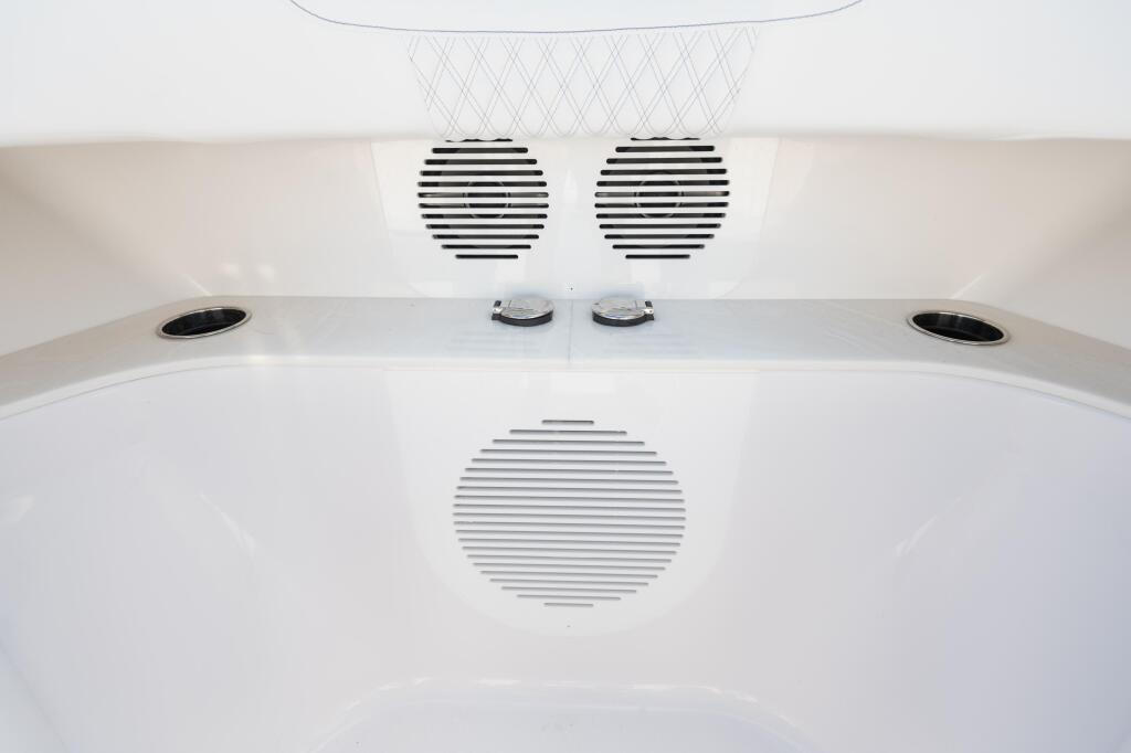 Boat cabin ceiling with dual speakers, ventilation grilles, and recessed lighting fixtures