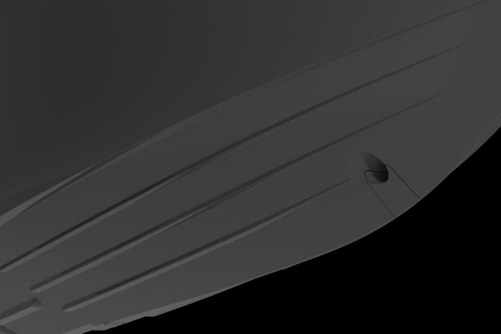 Close-up of boat hull showing three parallel strakes running along the curved fiberglass surface