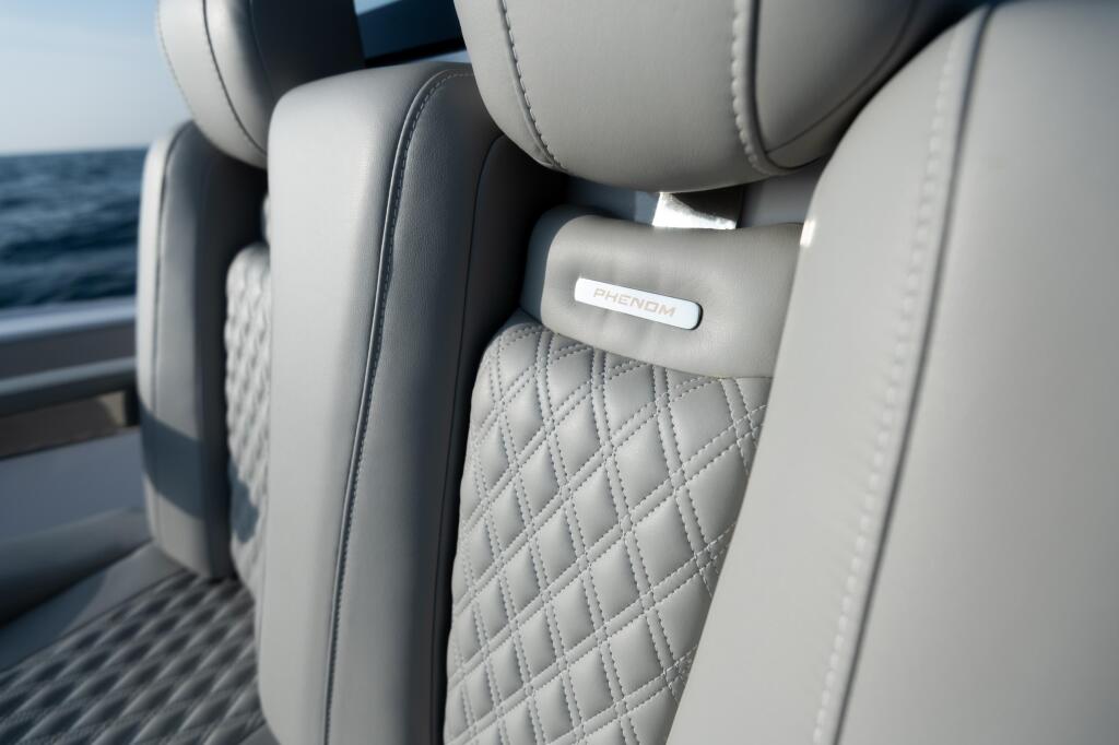 Luxurious quilted gray upholstered seating with Phantom nameplate in a boat cabin