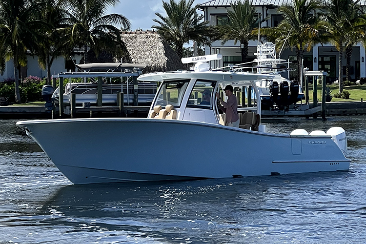 Cover image for the post Phenom 34 Delivered to Stuart, FL: Elegant Ice Blue and Faux Teak Finish